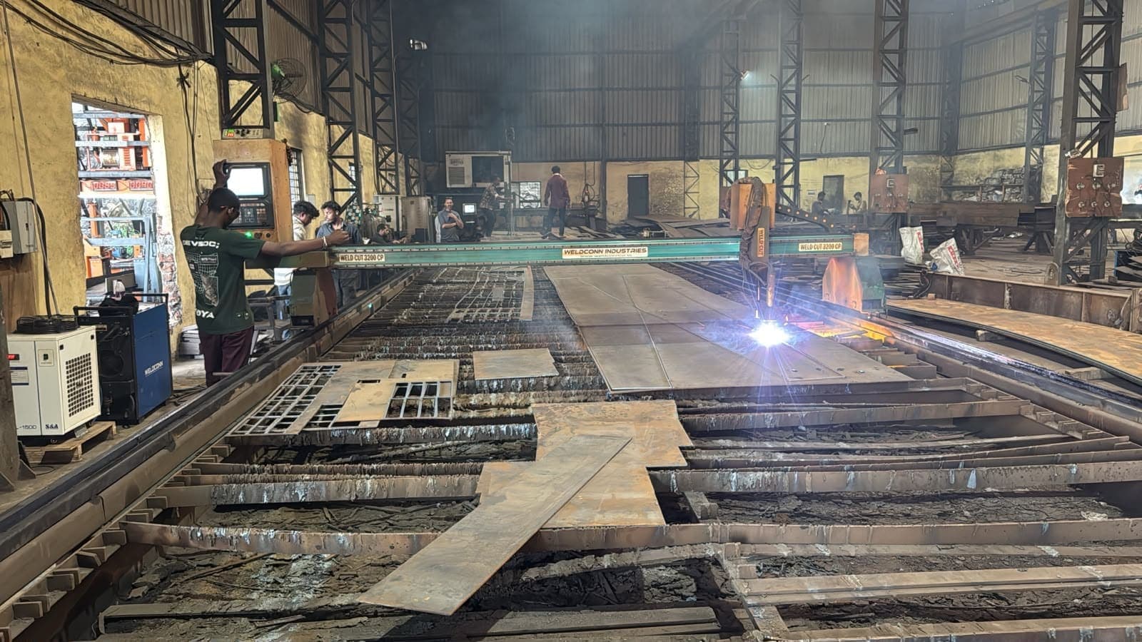 Weldcon 200 CNC plasma machine cutting steel plate