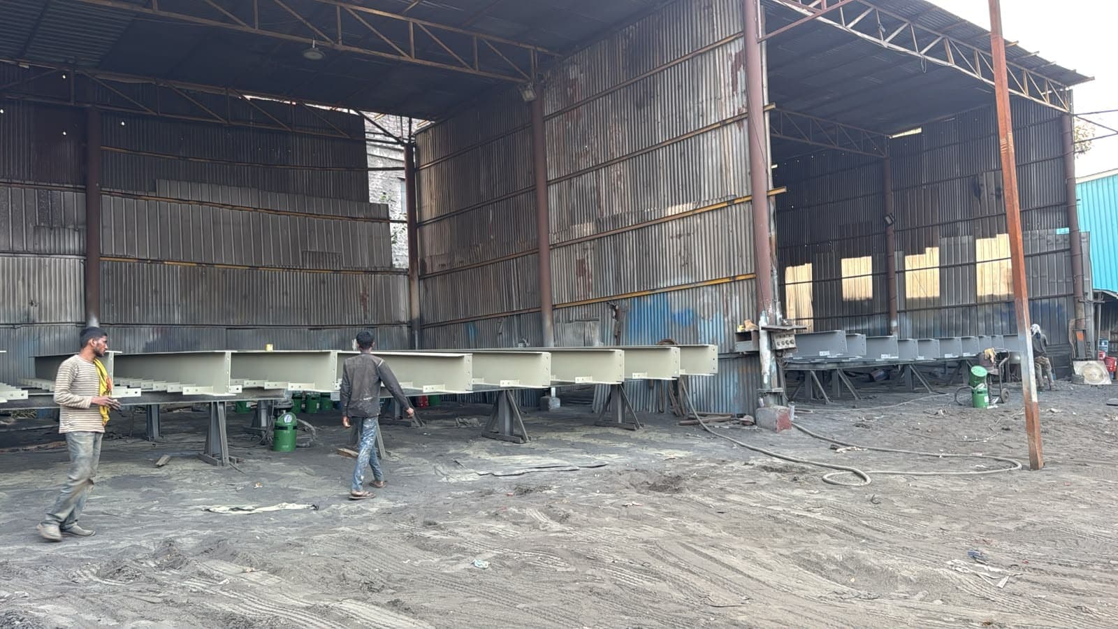 Primed built-up sections lined up in the painting bay