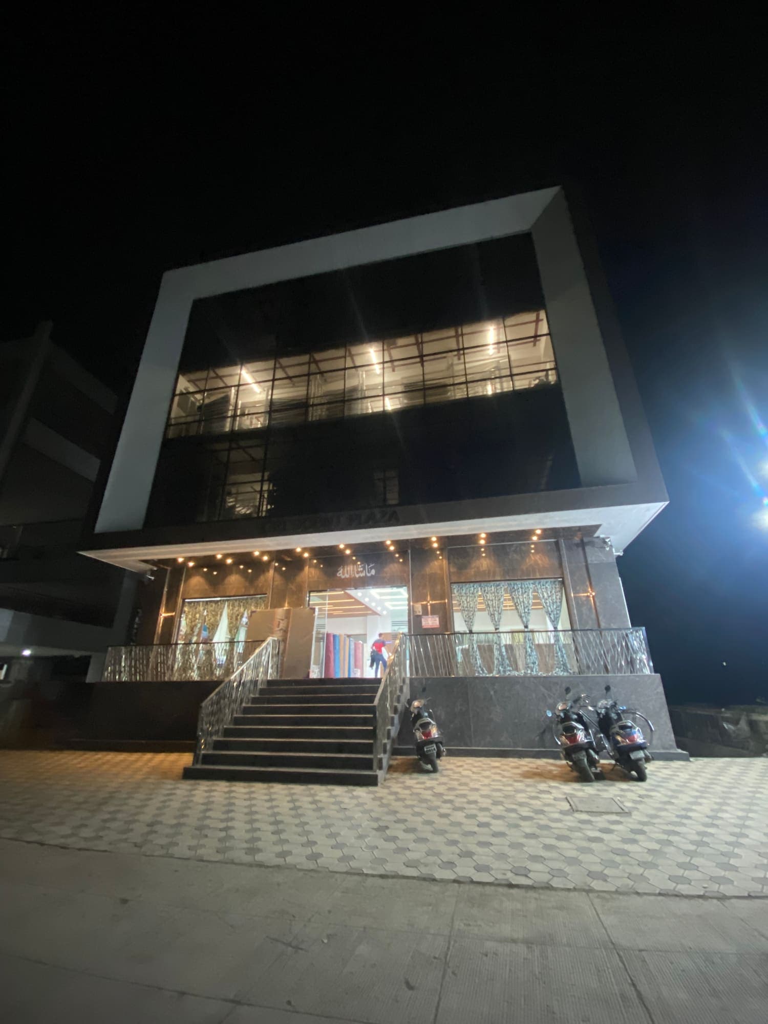 Crescent Furnishing showroom facade lit at night