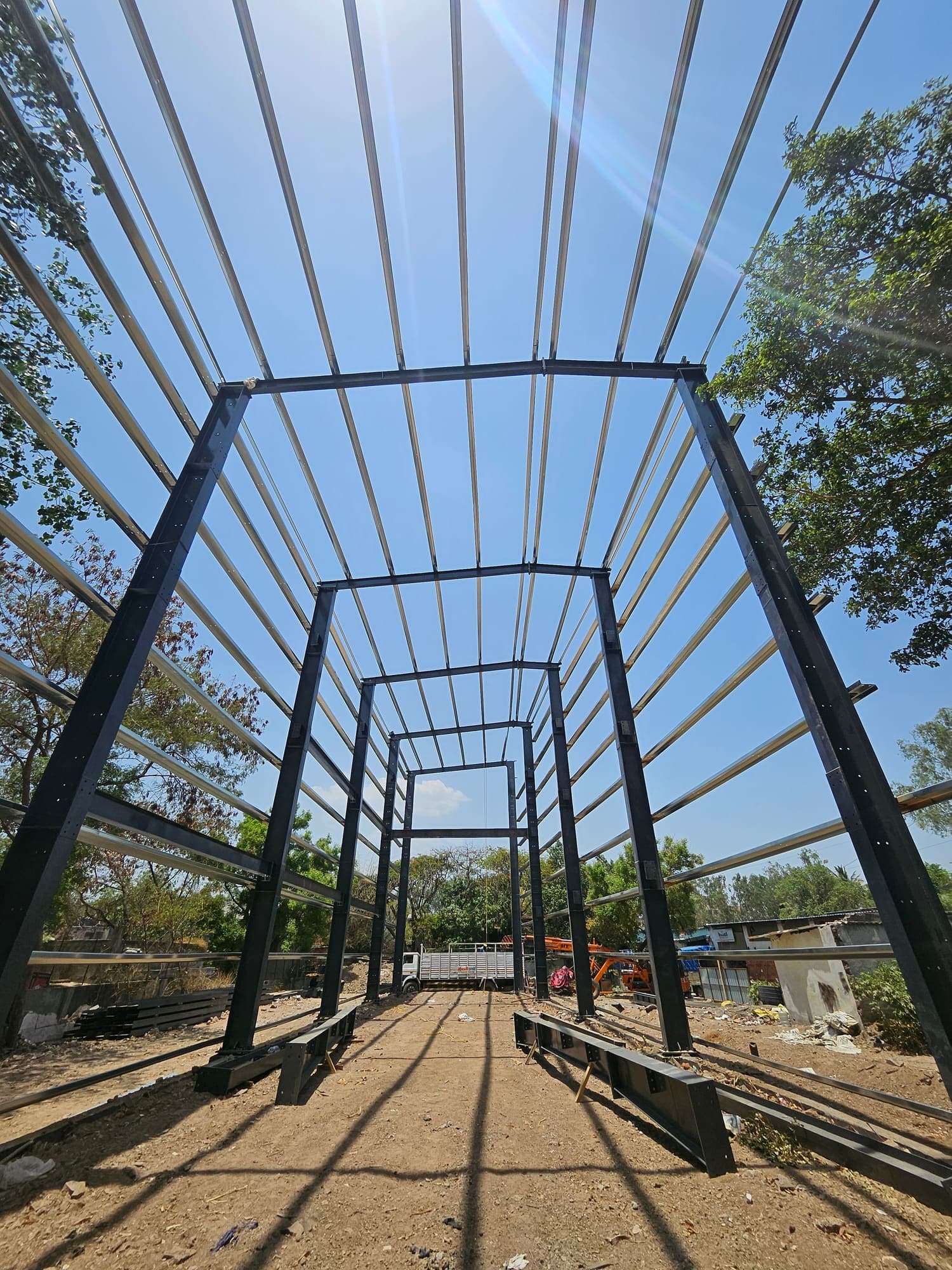 Looking up through the erected portal frames and roof purlins