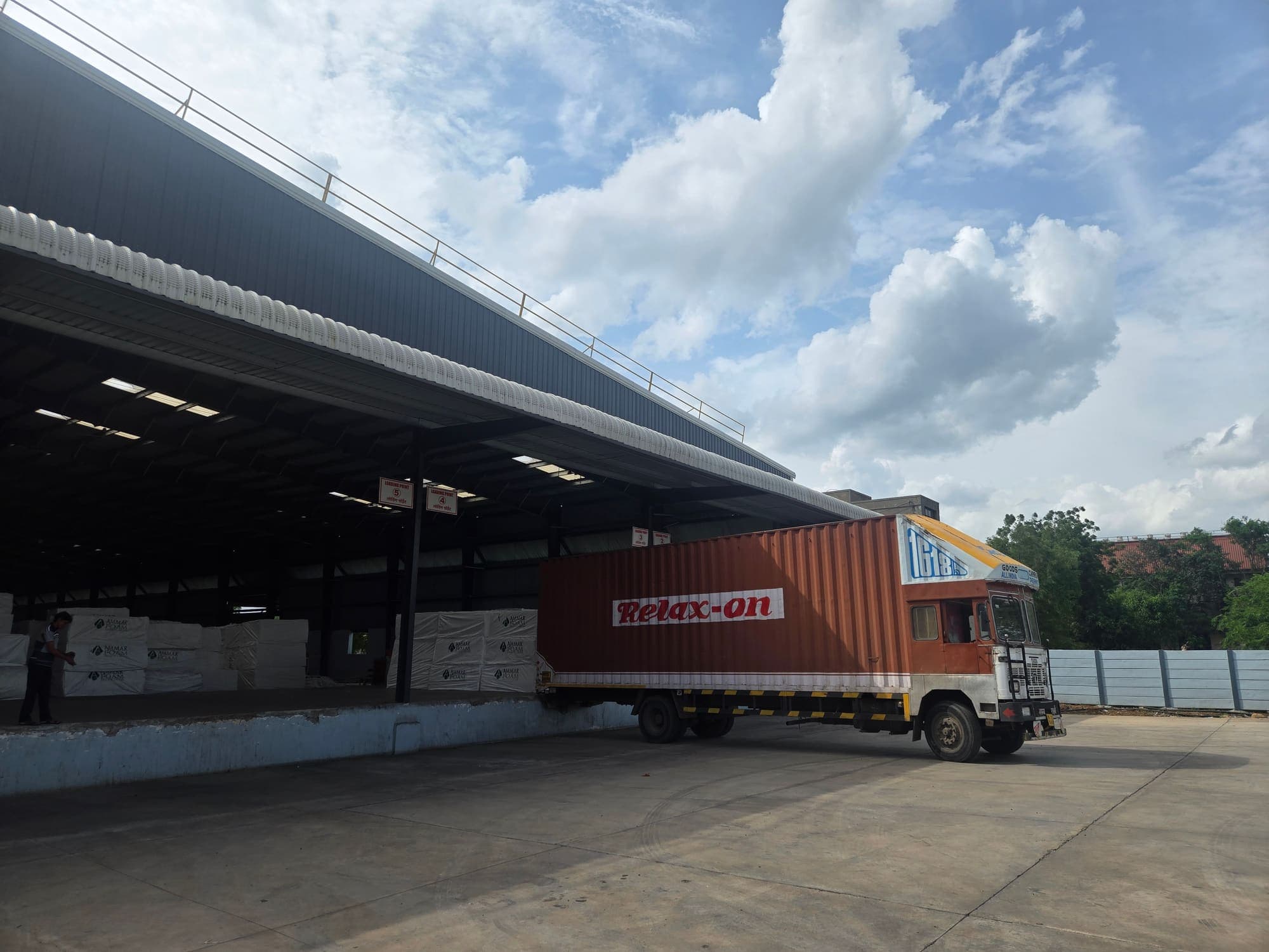 Container truck backed into the stockyard loading bay